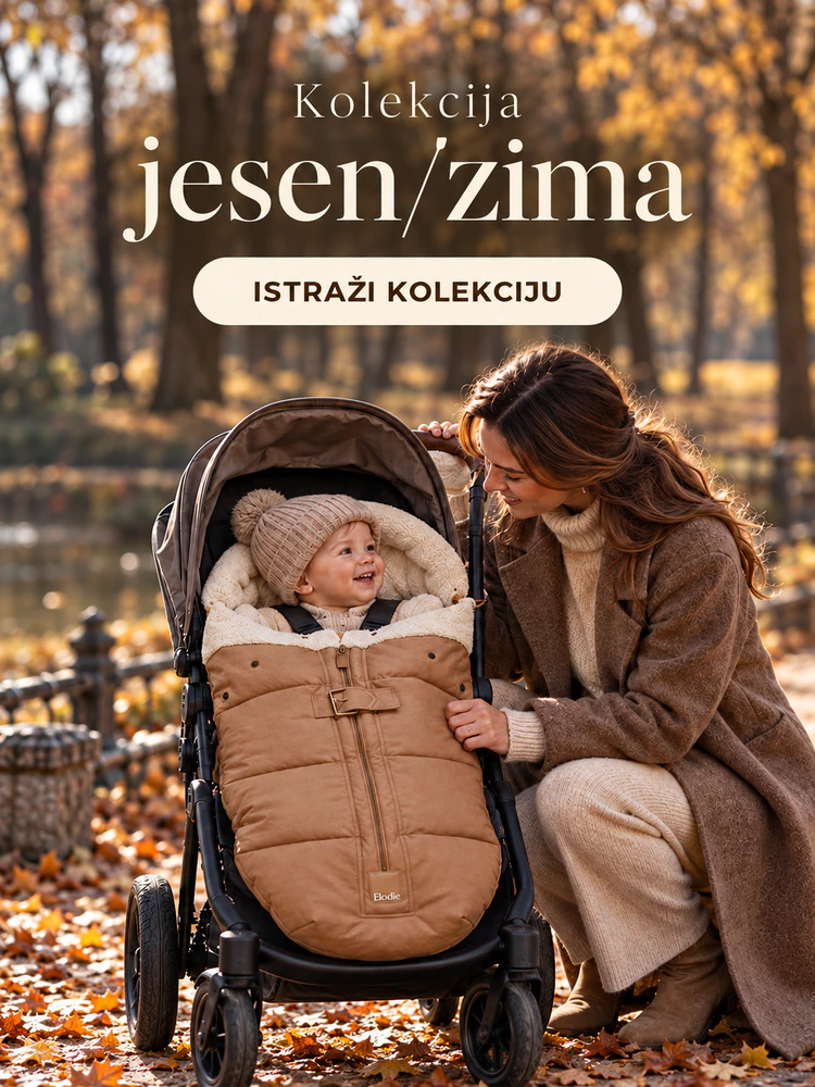 Kolekcija jesen/zima — majka i dijete u kolicima sa smeđom zimskom vrećom tokom jesenske šetnje.